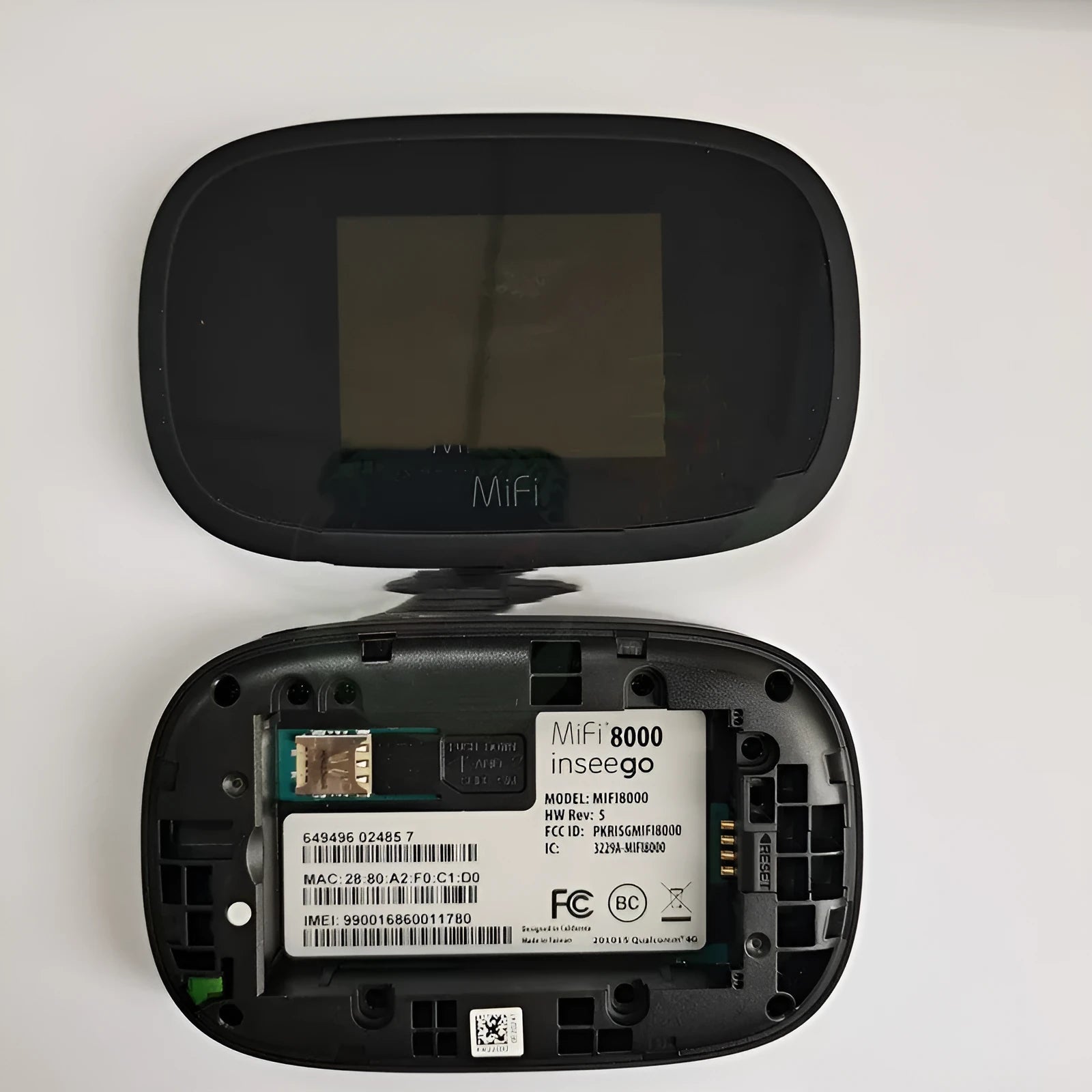 Black MFI8000 4G portable wireless router with battery and data cable.