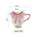 Ceramic mug with bow and heart design in white powder or black pink colours