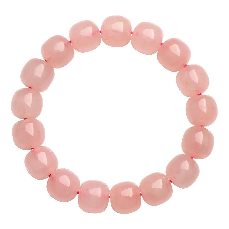 Natural pink crystal barrel bead bracelet with 8x10mm geometric beads on wrist
