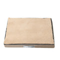 Brown removable washable sponge dog mat with velvet finish on a sofa