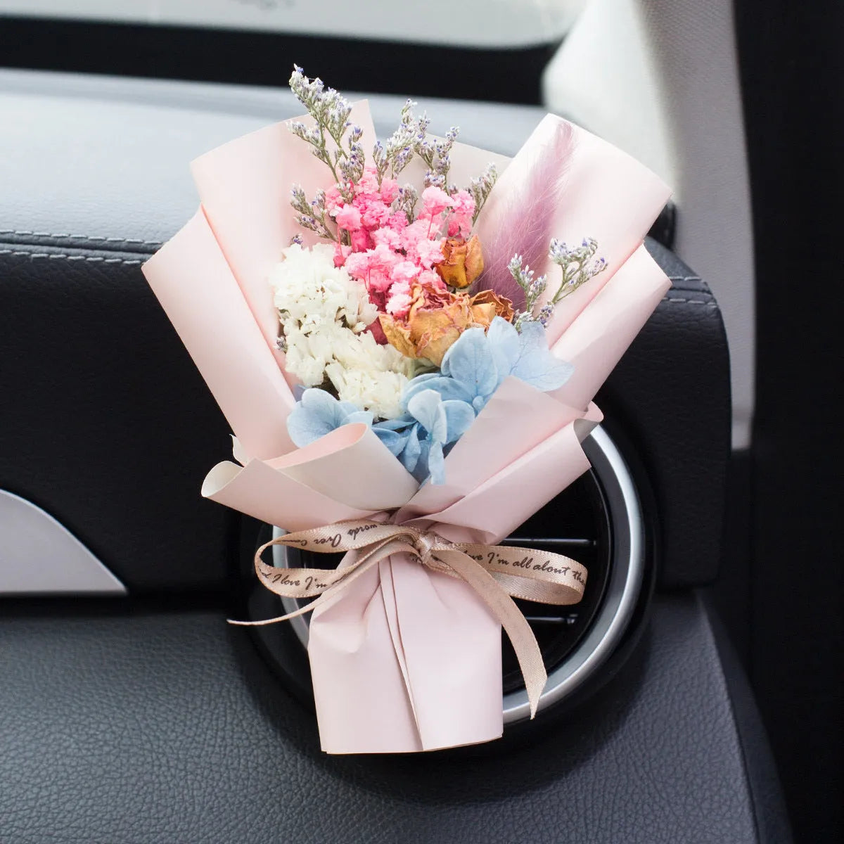 Handmade dried flower car vent ornament with interchangeable scented discs in multiple colour options
