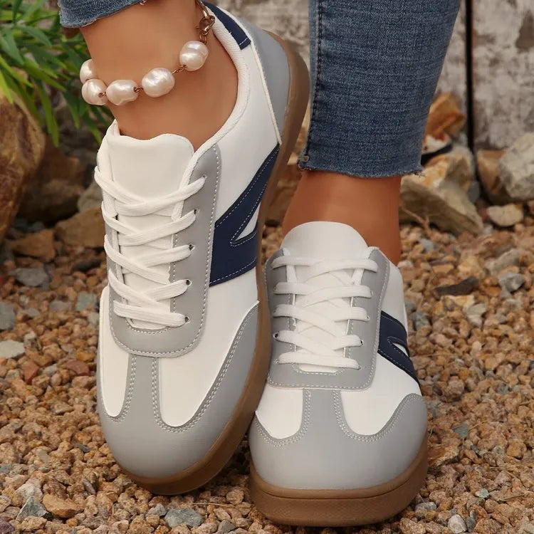 Blue women's low-top lace-up hiking shoes with an artificial PU upper and rubber sole.