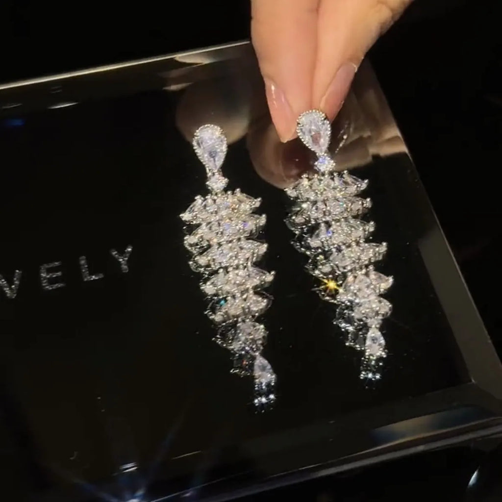 Silver pagoda Christmas tree drop earrings with sparkling zircon stones and copper construction