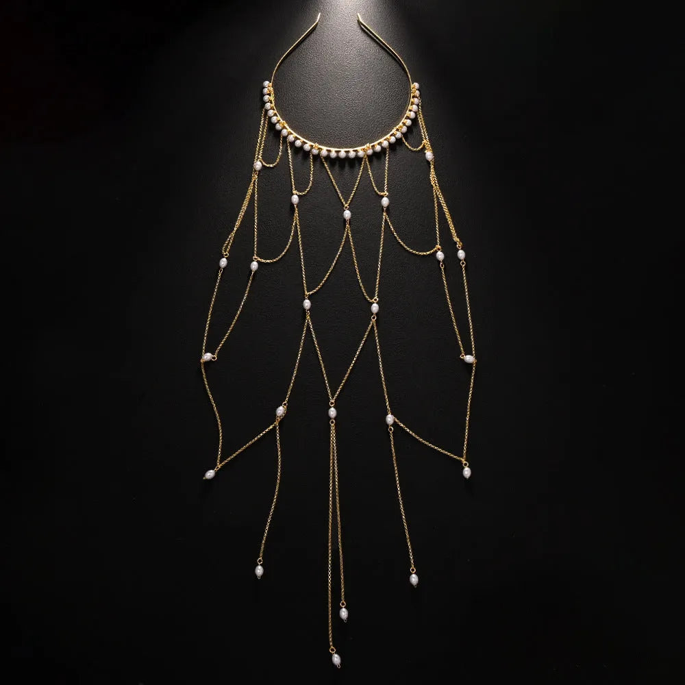 Women's gold mesh tassel hair chain with pearl decorations on dark hair