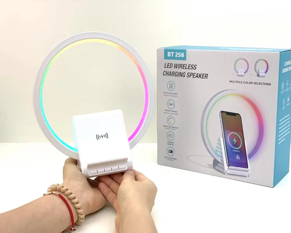 White rectangular Bluetooth speaker with wireless charging pad and ambient lighting