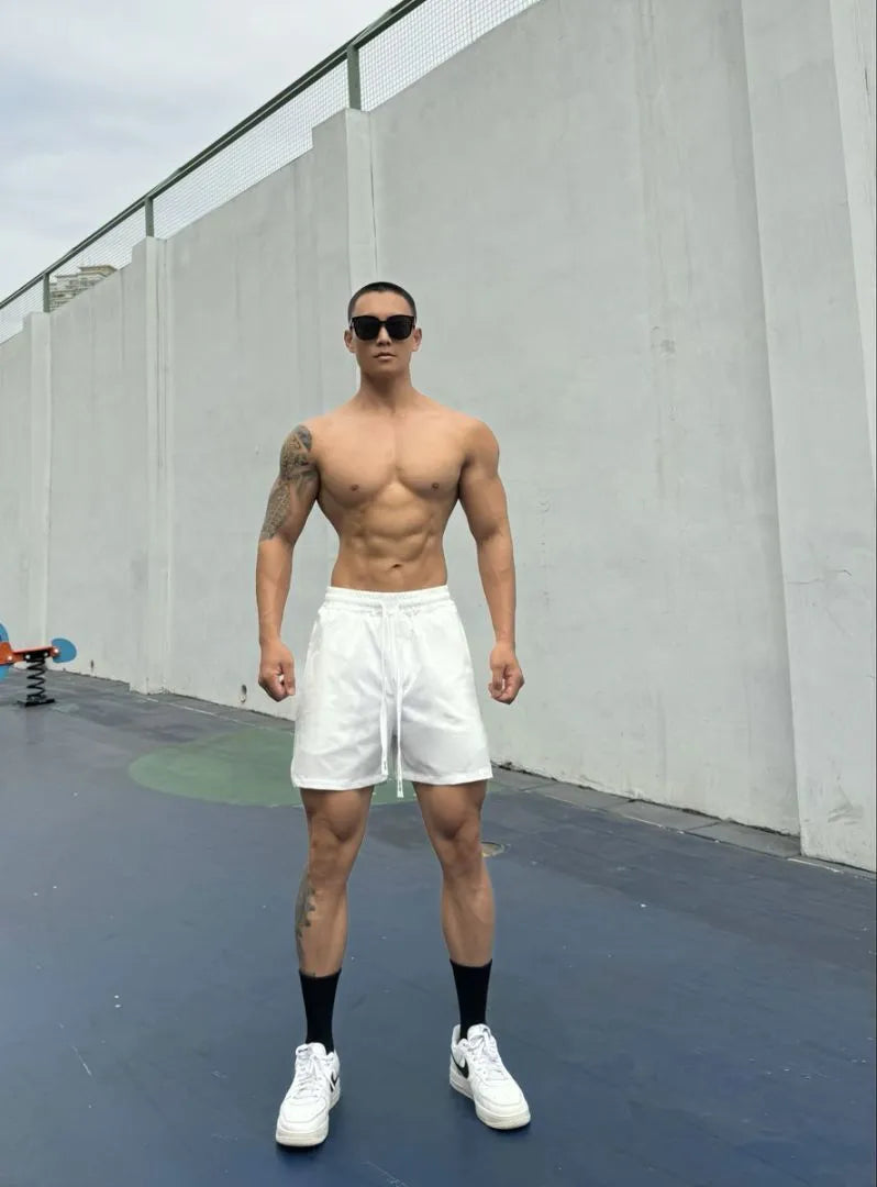 Man wearing grey ice silk quick-drying double-layer quarter shorts on a casual day out.