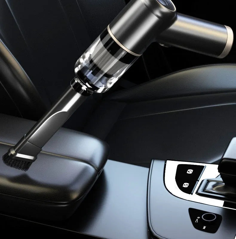 Black wireless car vacuum cleaner with accessories including brush heads and nozzles for vehicle interior cleaning