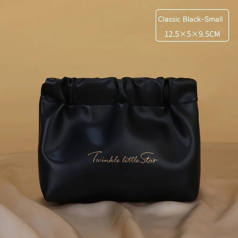 Leather travel toiletry bag in caramel mocha colour with large capacity and dry-wet separation compartments.