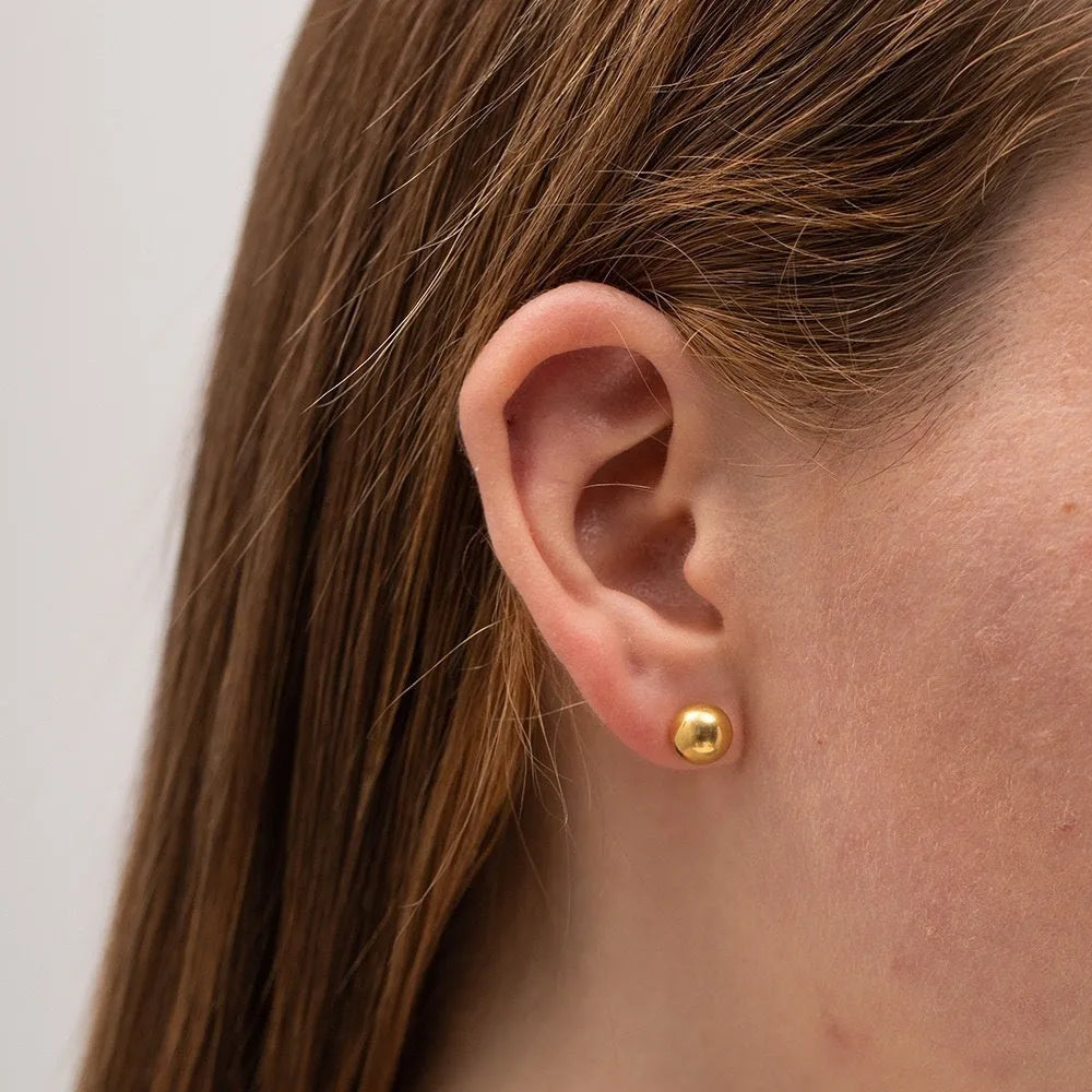 Stainless steel ball stud earrings with geometric round design in gold or silver electroplated finishes