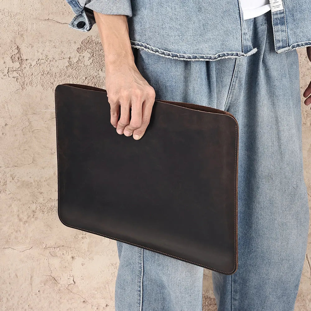 Men's brown horizontal leather liner bag with top handle and Crazy Horse cowhide texture