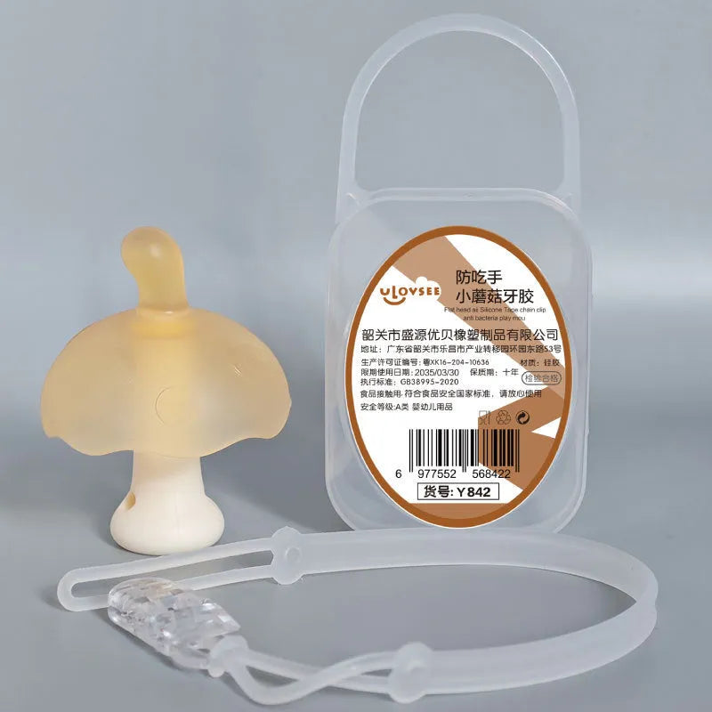 Small mushroom-shaped silicone chew gum with transparent chain attachment in pink colour