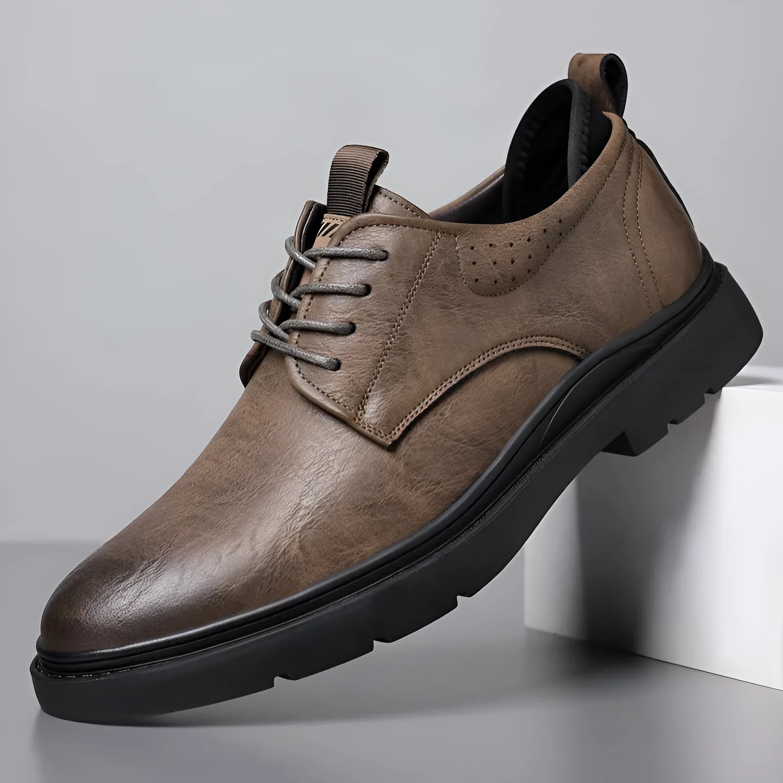 Men's black leather sneakers with decorative sewing lines and rubber sole shown in size 42