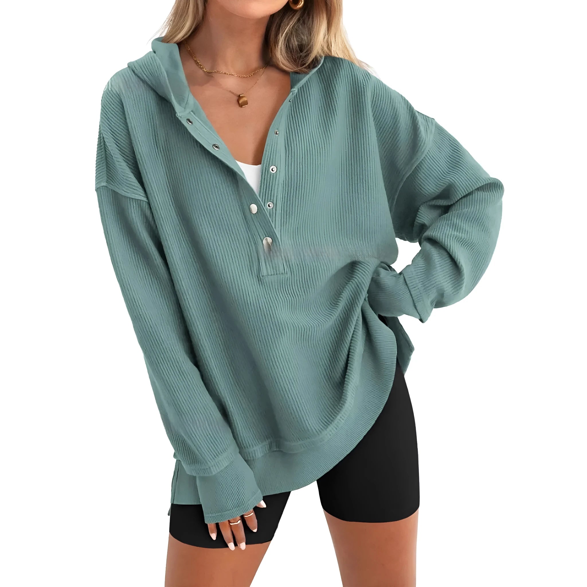 Women's loose fit raglan sleeve sweater in peacock green, shown on a model.