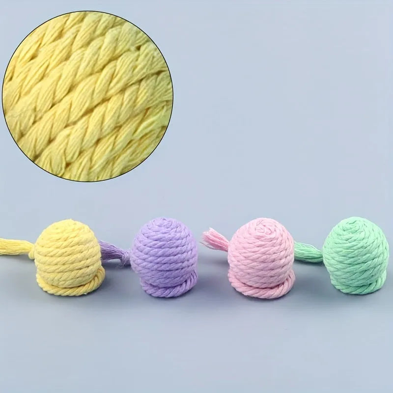 Colourful cat toy ball with rope handle and built-in bell for interactive play