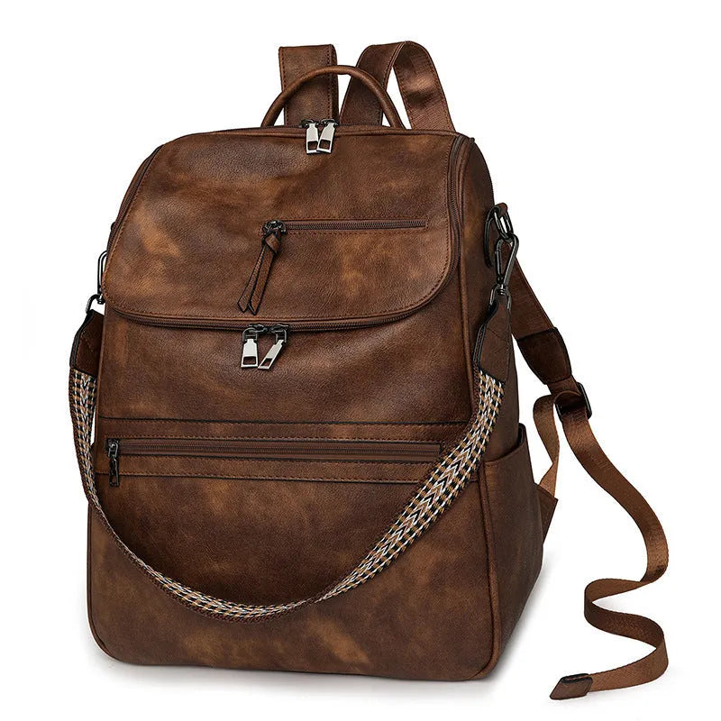 Retro college student backpack in PU leather with curved shoulder straps showing stitching detail