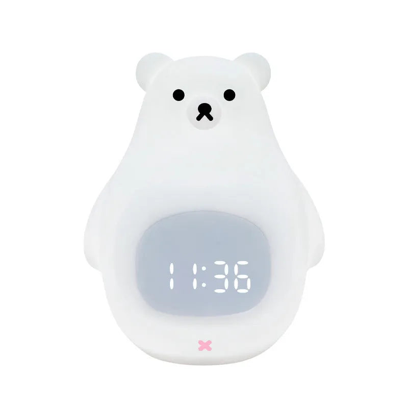White cartoon bear silicone night light with remote control on table.