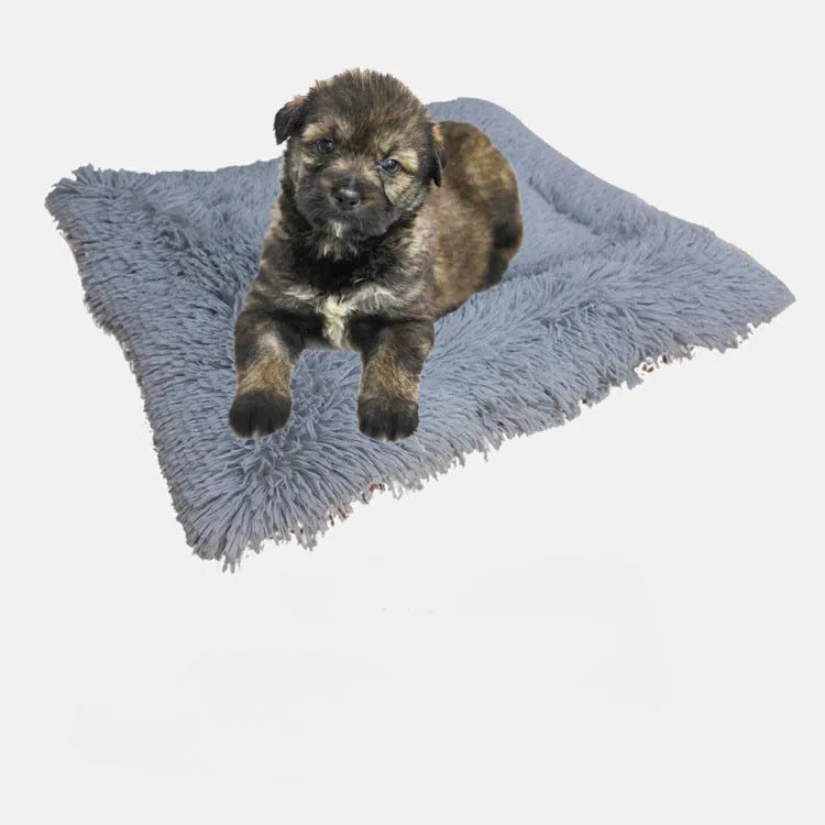 Grey and white long plush pet bed with black non-slip bottom particles