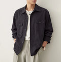 Men's simple lapel long sleeve shirt in light sand rice colour, cotton blend fabric, laid flat.