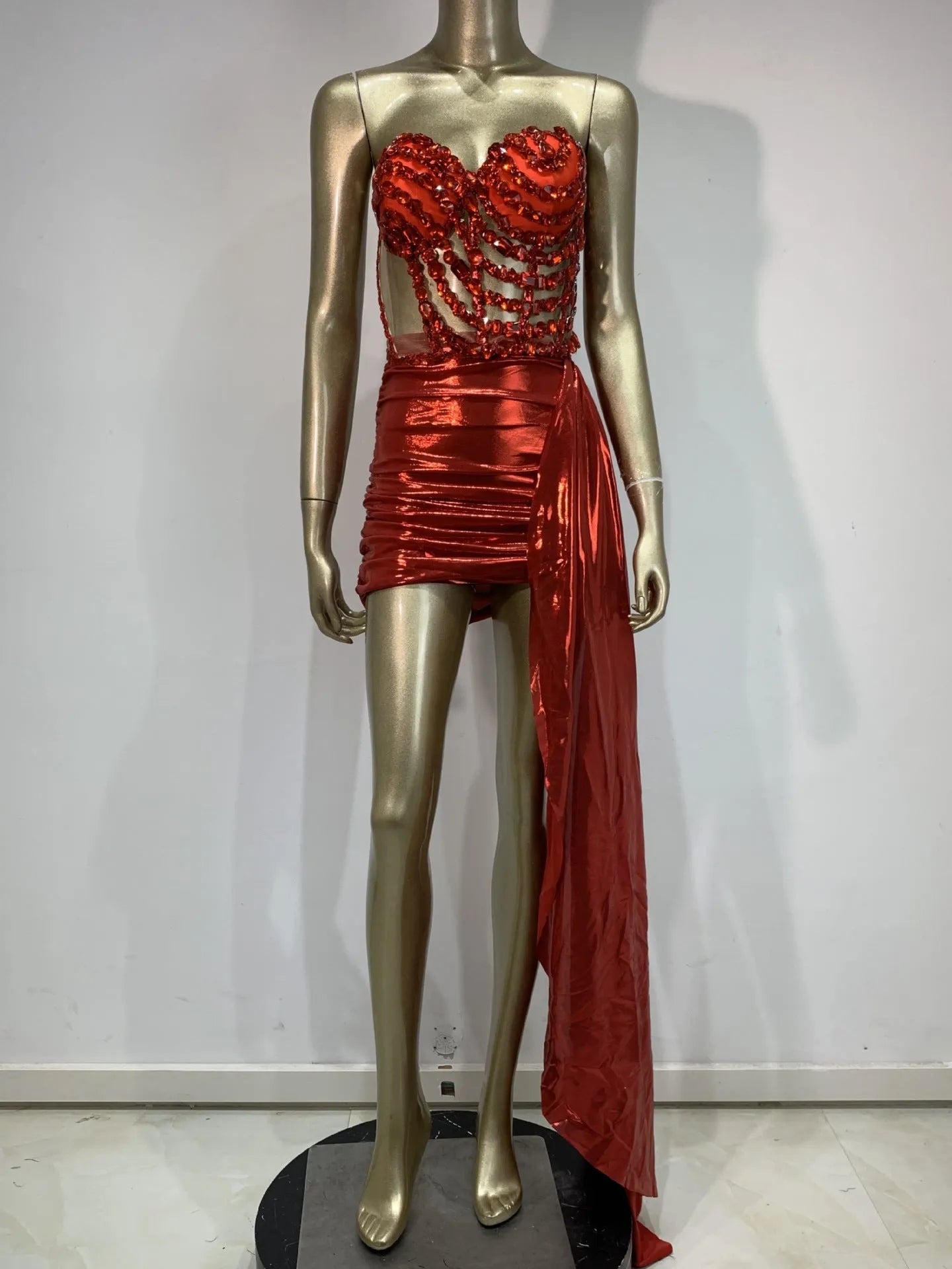 Red women's skirt suit with mesh see-through panels, a stage and party costume.