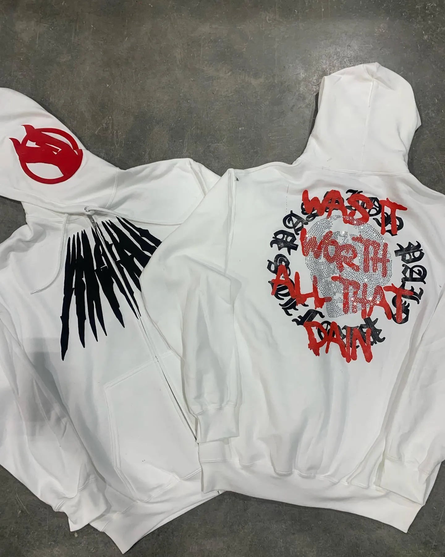 Black loose hooded sweatshirt with printed skull pattern and hot rhinestone detailing, cardigan style