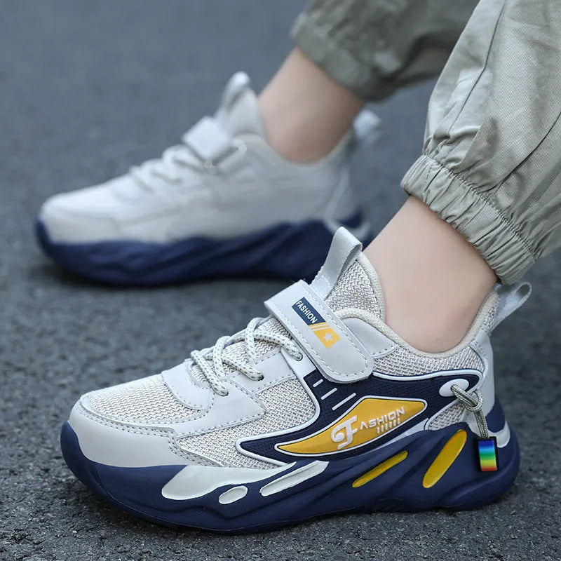 Boys' dark blue and black sports running shoes with velcro strap and mesh upper.
