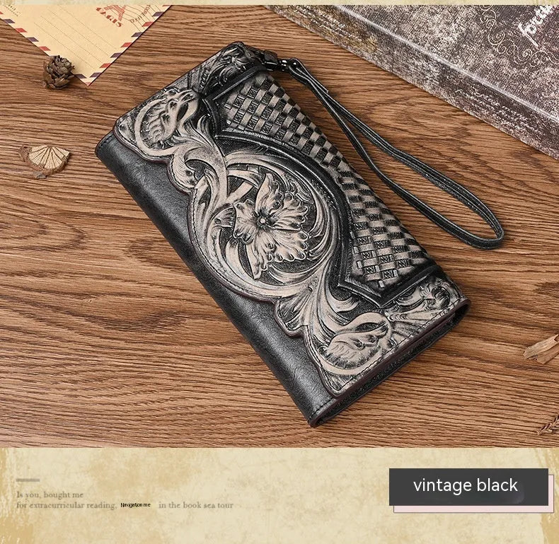 Retro brown floral embossed tri-fold leather wallet open to show interior compartments.