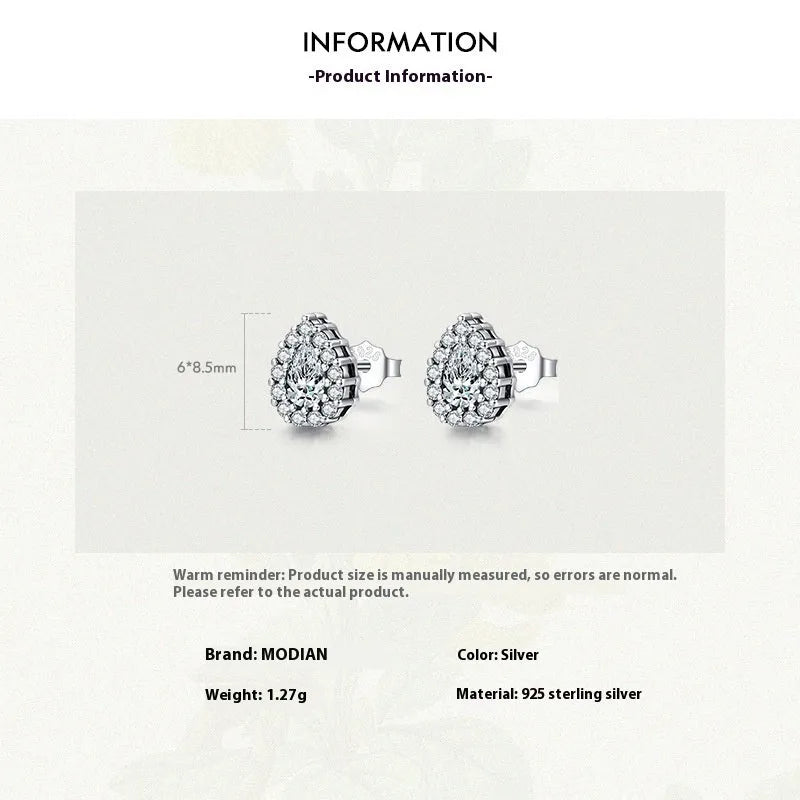 A pair of women's silver drop-shaped ear studs made from 925 sterling silver.