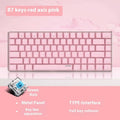 82-key mechanical keyboard with white backlight and metal construction beside laptop