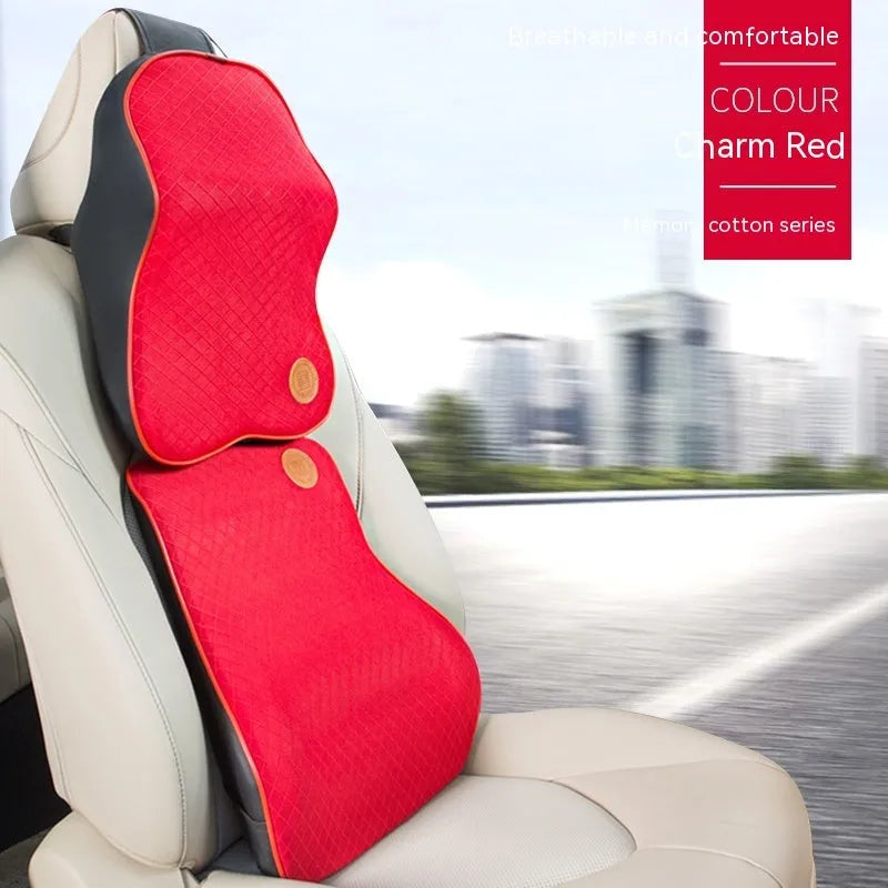 Black and brown memory foam car headrest and lumbar support pillows on a car seat.
