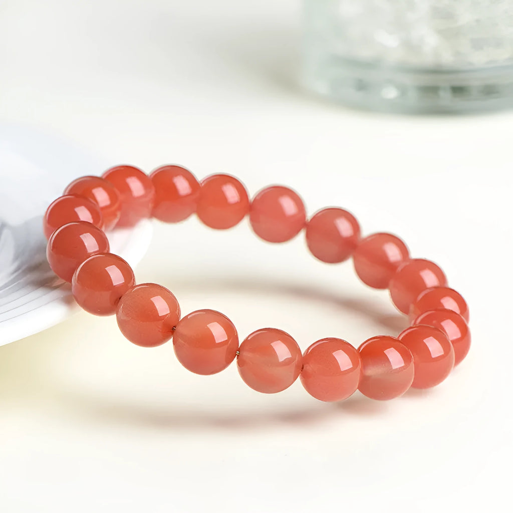Natural polished cherry red agate scattered beads bracelet on a wrist, showing single circle and three circle size options.