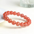 Natural polished cherry red agate scattered beads bracelet on a wrist, showing single circle and three circle size options.