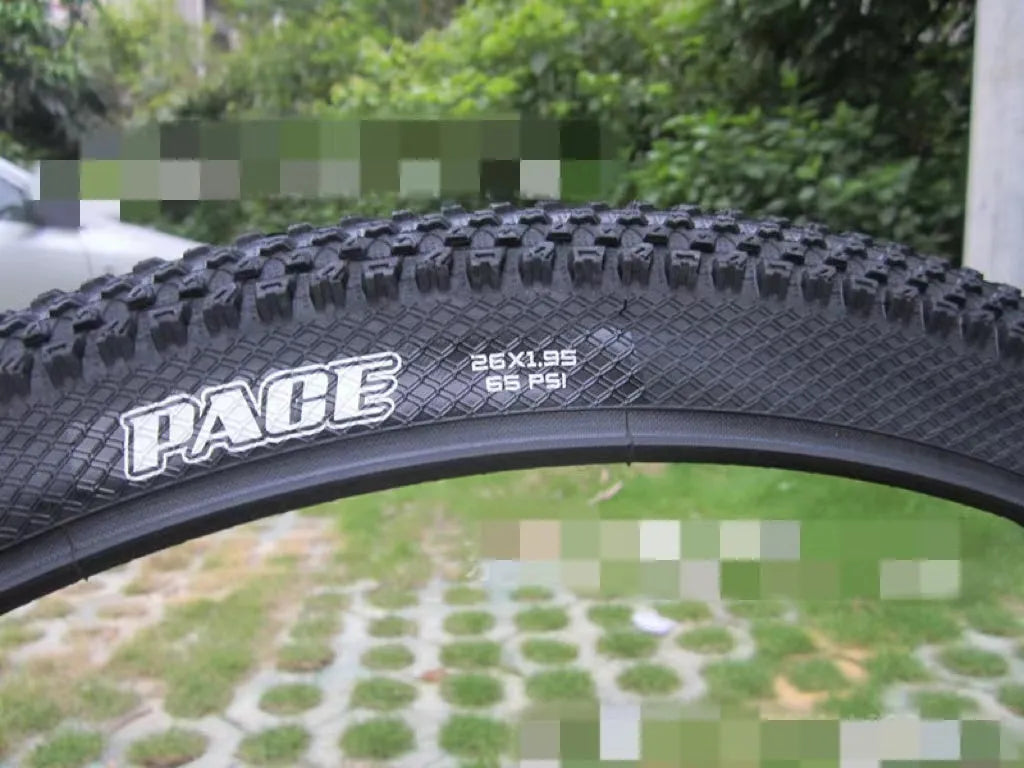 Ultralight mountain bike tyre with tread pattern shown, available in multiple sizes including 26, 27.5 and 29 inch diameters.