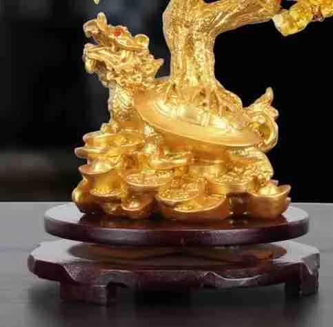 Citrine-coloured Chinese style resin turtle money tree ornament on display.