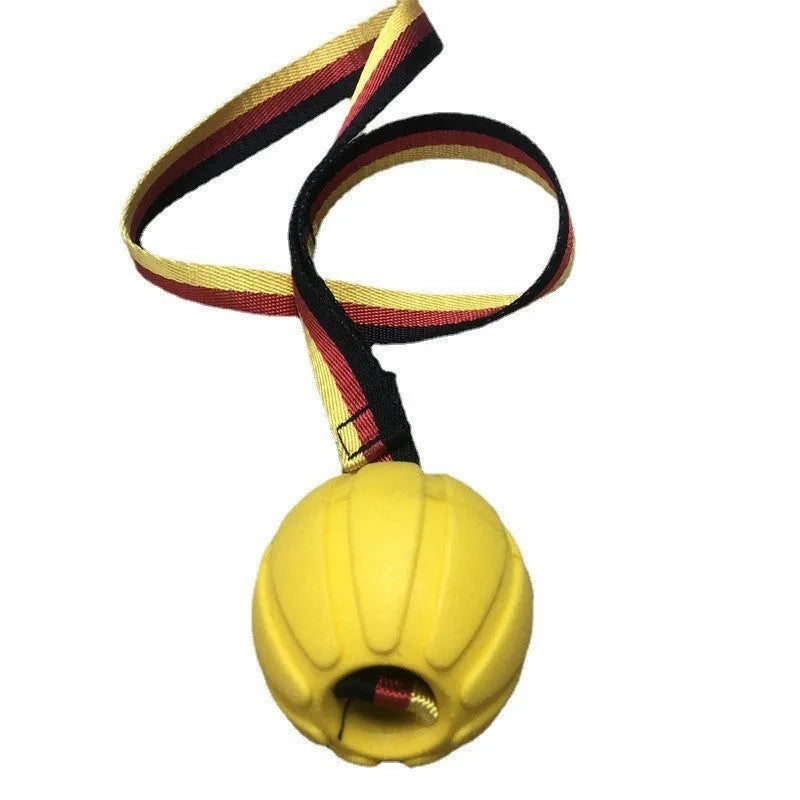 Yellow and camouflage floating EVA foam dog balls with tether strings in three different sizes on a blue background.