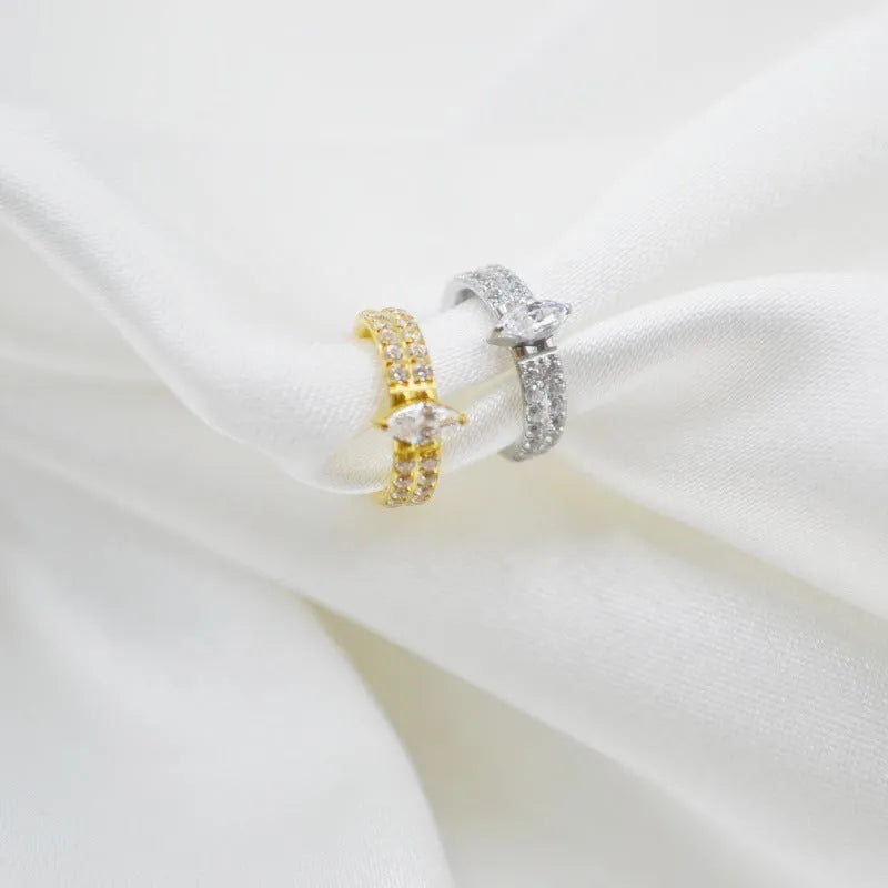 Titanium steel heart-shaped earrings with zircon stones in silver tone, showing post and butterfly back.