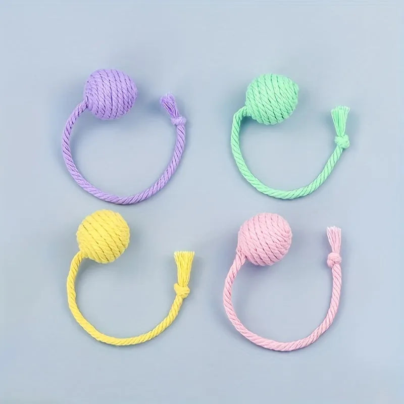Colourful cat toy ball with rope handle and built-in bell for interactive play
