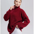 Women's solid colour high neck loose fit pullover sweater on a hanger