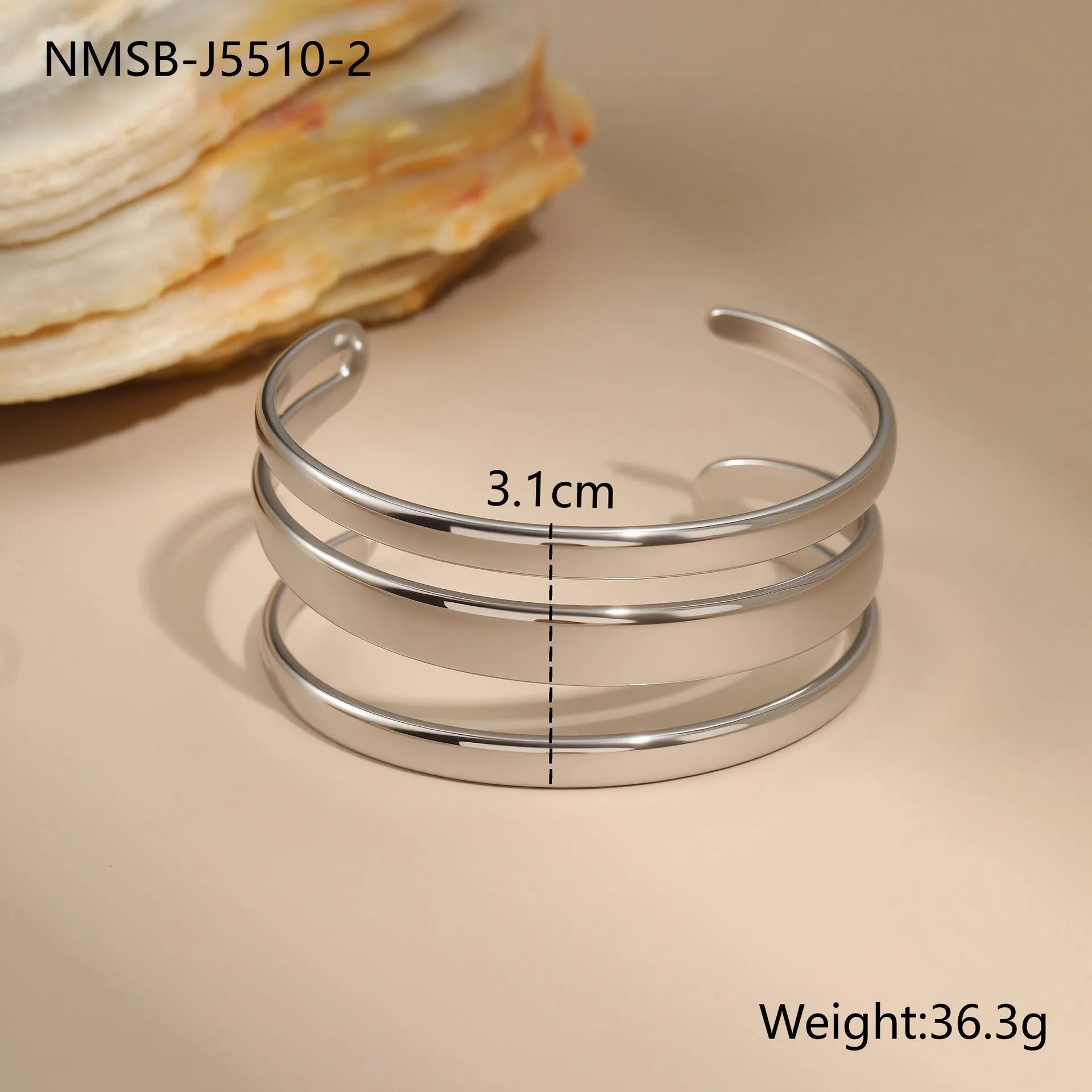Geometric line design stainless steel women's bracelet with a simple opening clasp, shown in gold and steel colour options.