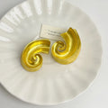 Geometric retro design alloy ear studs in gold or silver colour, 5cm size.