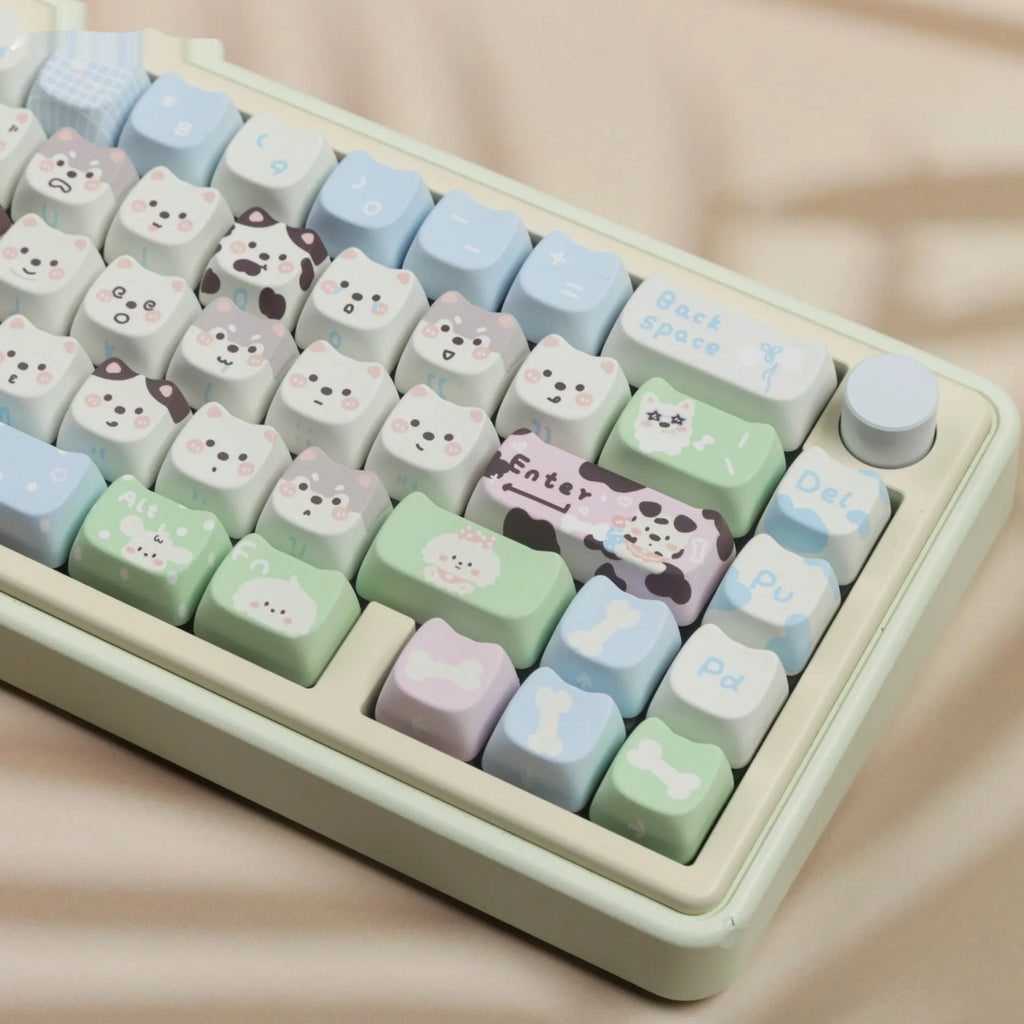 PBT sublimation key cap set showing colourful cat and puppy character designs on mechanical keyboard keys