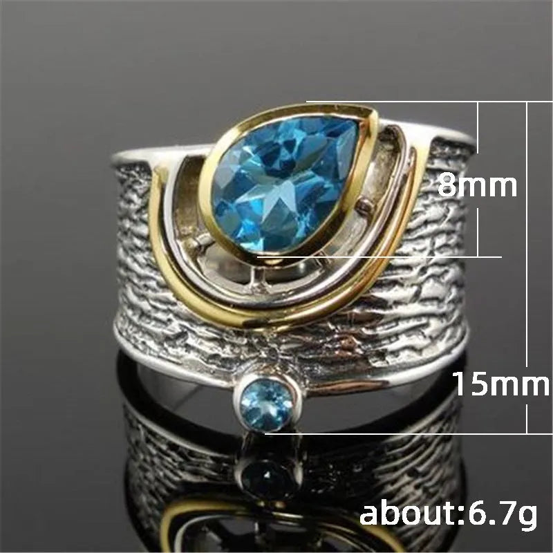 Blue zircon Chinese style drop shape alloy ring with rhinestone detailing on silver-toned band