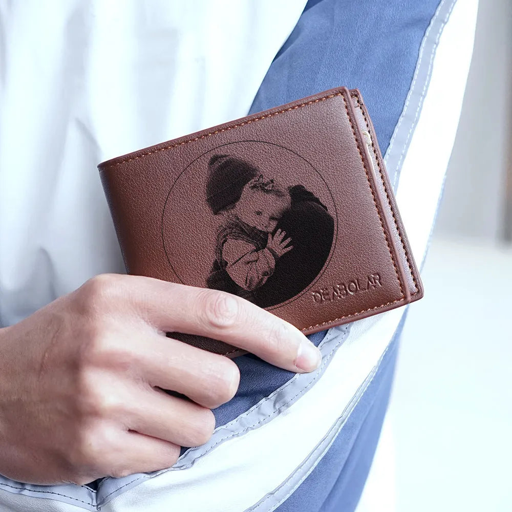 Men's brown leather wallet with a zipper closure, shown individually packaged.