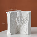 Glazed ceramic book stand sculpture in one of four modern styles: Lover, Dancer, Beauty and Beast, or Brushed Face.