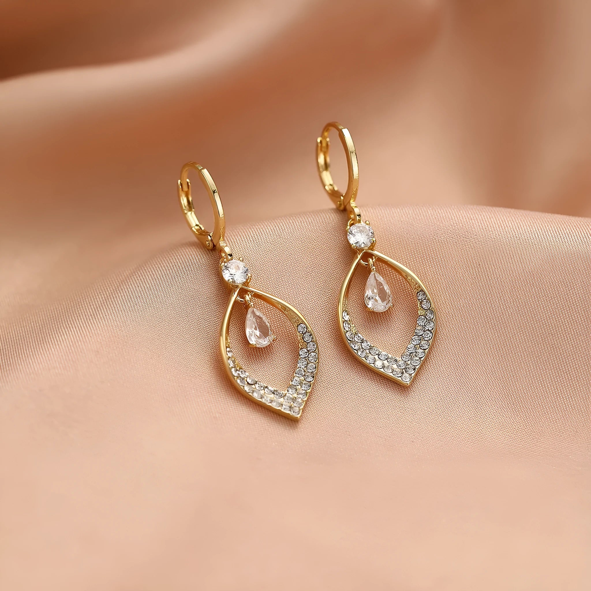 Gold and silver coloured zircon water drop tassel earrings with a tear-drop shape.