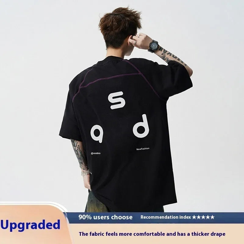 Loose fit black cotton t-shirt with a white letter print design on the front.