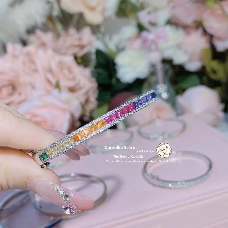Rainbow colourful copper geometric wristband with gold inlay, 54mm inner diameter, on white background