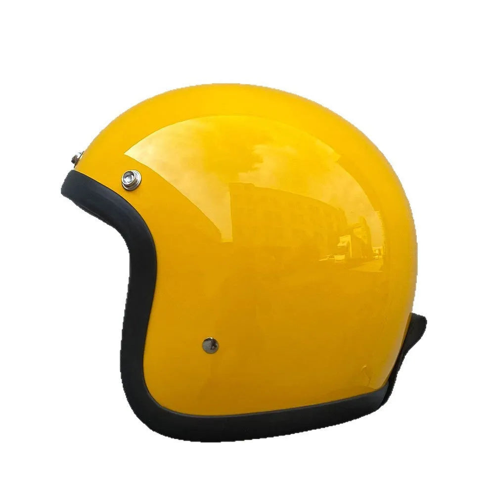 A cement grey retro-style motorcycle half helmet with a floral pattern on the side, showing its open-face design.
