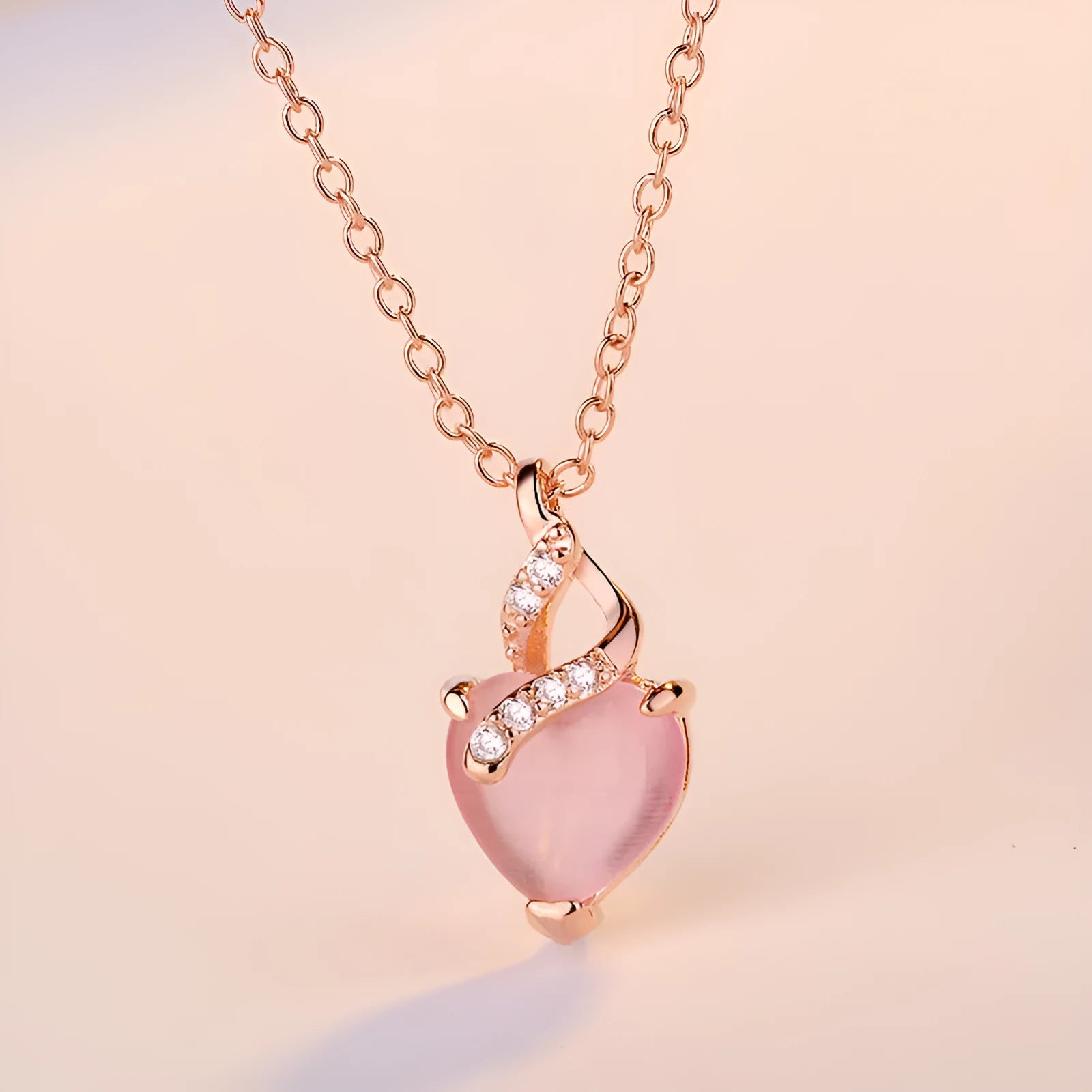 Rose gold electroplated heart-shaped crystal pendant necklace with cross chain design