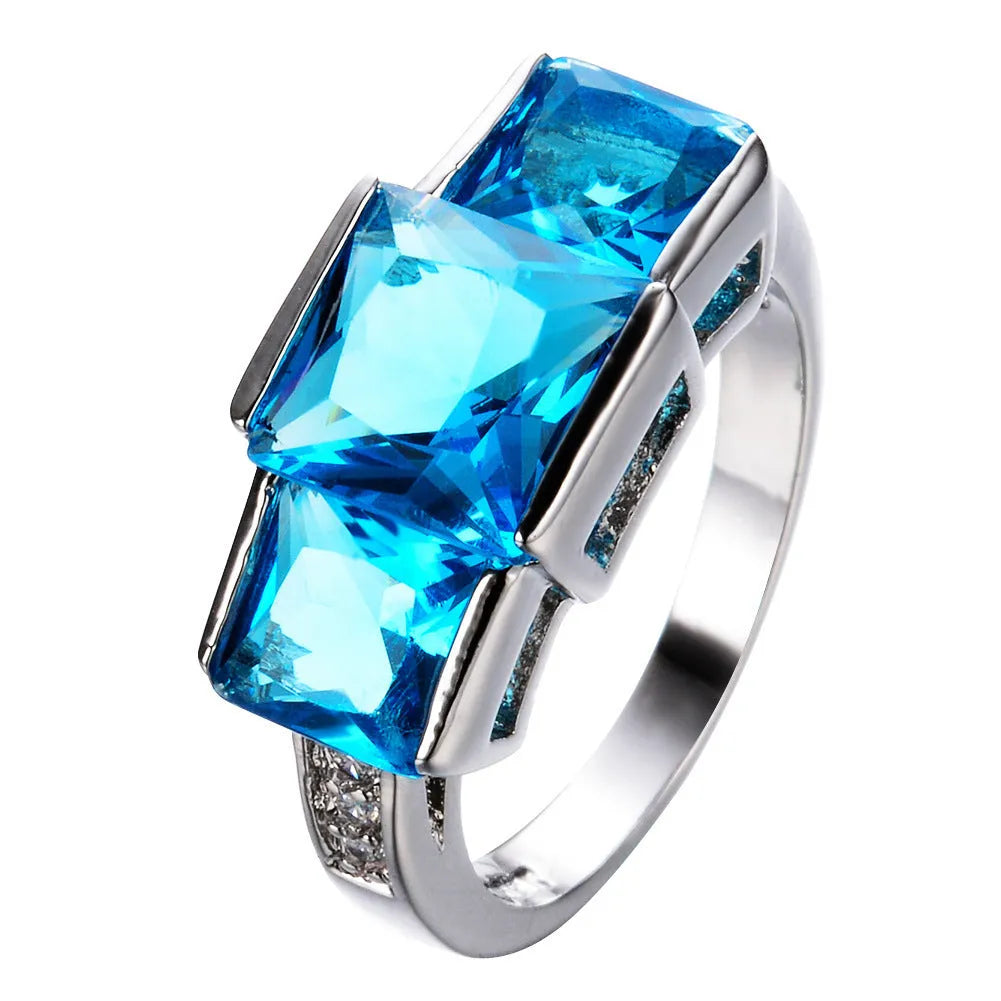 Women's copper alloy ring with electroplated geometric pattern in rainbow colours showing apple green option