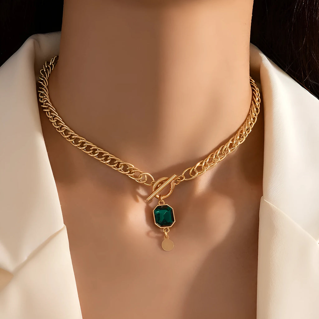 Gold electroplated titanium steel necklace with geometric emerald zircon pendant on Cuban link chain
